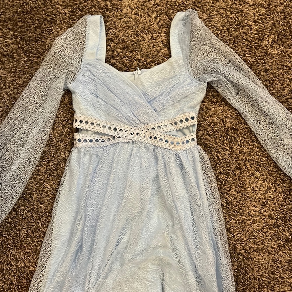 Mini dress with side cut outs and sheer sleeves